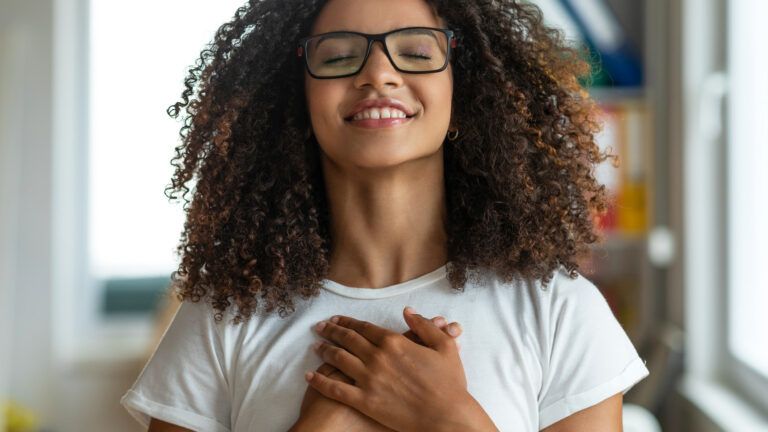 A young woman prays