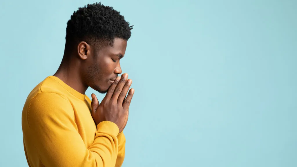 A man in contemplative prayer.