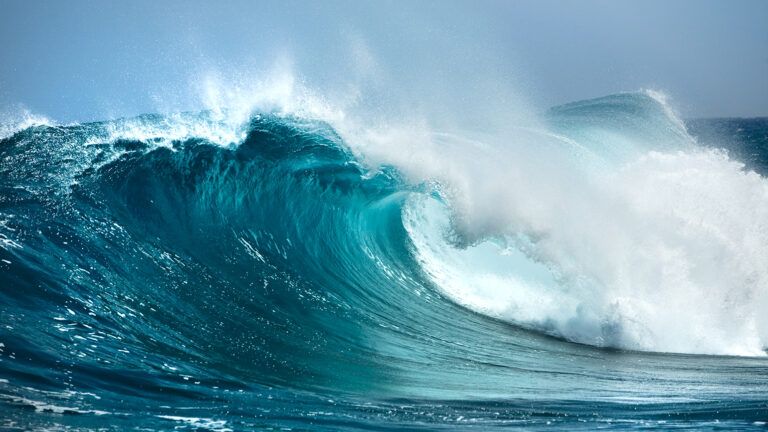 Royalty-free image: Ocean waves crash on a beach; Getty Images